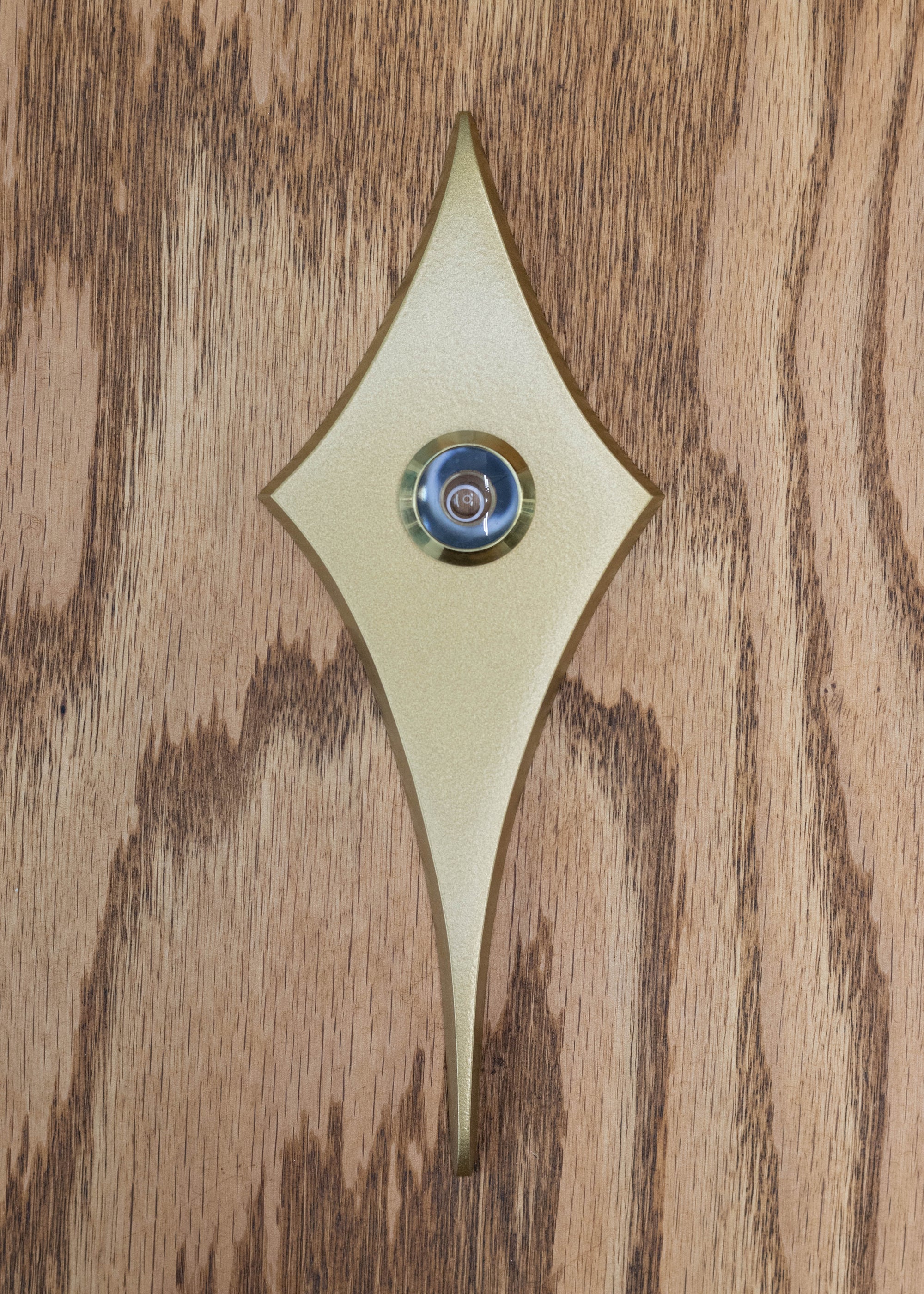 Gold coated comet peephole. The gold is very smooth and has a metallic shine to it, but is not as glossy as the silver. The peephole viewer has a gold rim.
