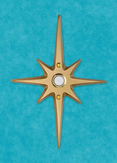 A standard toilet paper holder with two natural cast aluminum starbursts wear it attaches to the wall. They are silver with a metallic shine, and the hardware is chrome.