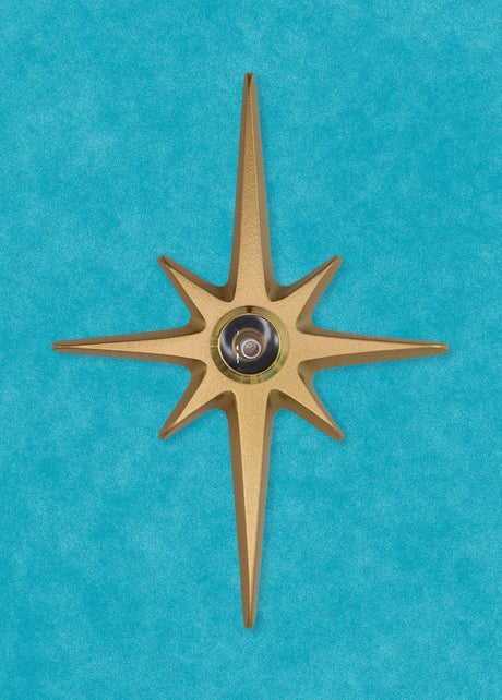 A standard toilet paper holder with two natural cast aluminum starbursts wear it attaches to the wall. They are silver with a metallic shine, and the hardware is chrome.