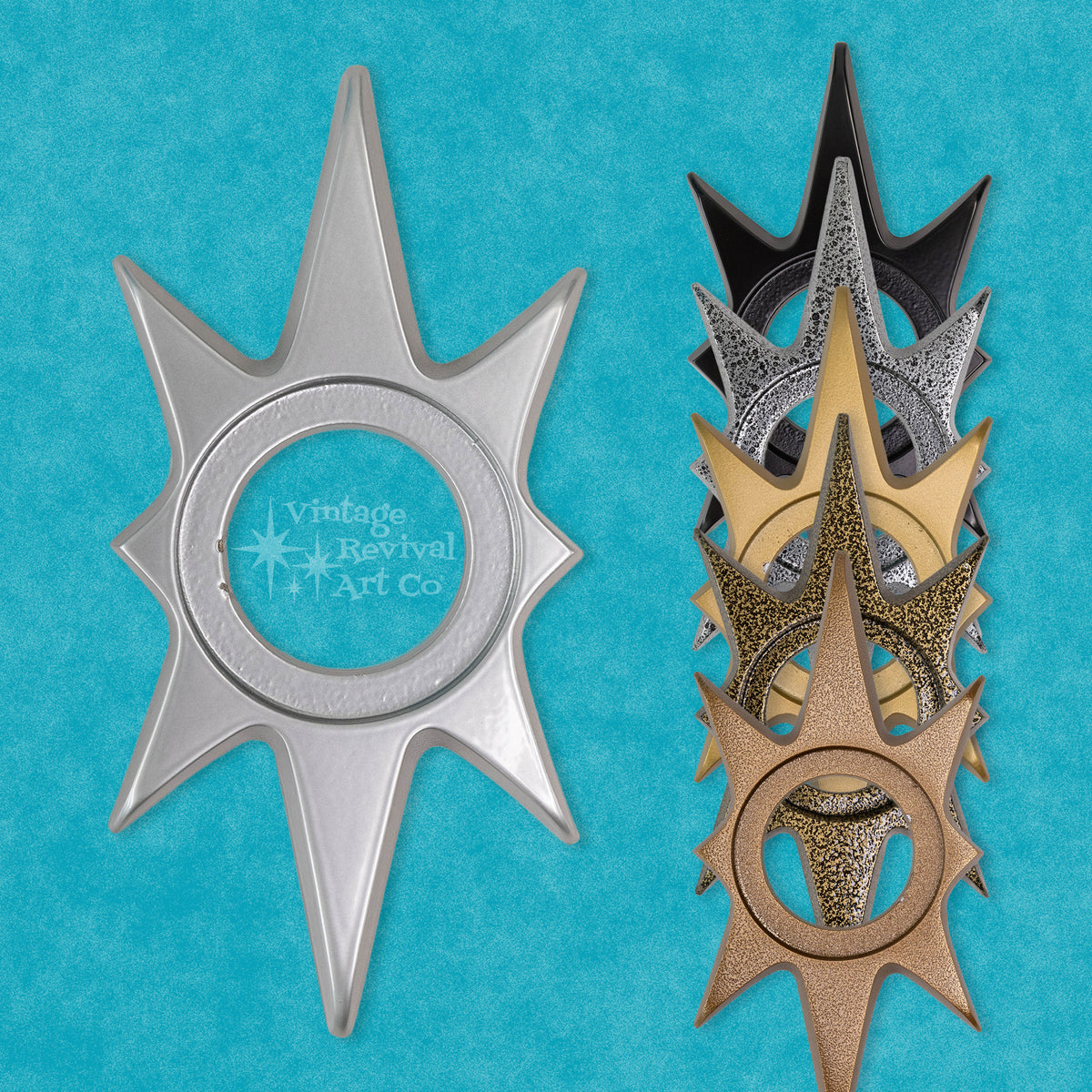 A collection of Atomic Starburst Escutcheons in various finishes including silver, gold, black, and bronze displayed against a blue background. Eight-inch Atomic Starburst cast aluminum doorknob escutcheon with sculptural Mid-Century Modern starburst shape.