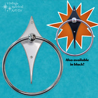 Comet Towel Ring featuring a silver powder-coated aluminum backplate and chrome-plated stainless steel towel ring.
