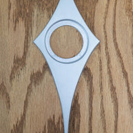 Bare aluminum comet escutcheon. There is no powder coating, so you can paint it whatever color you would like. The bare aluminum is brushed smooth and is a bright silver.