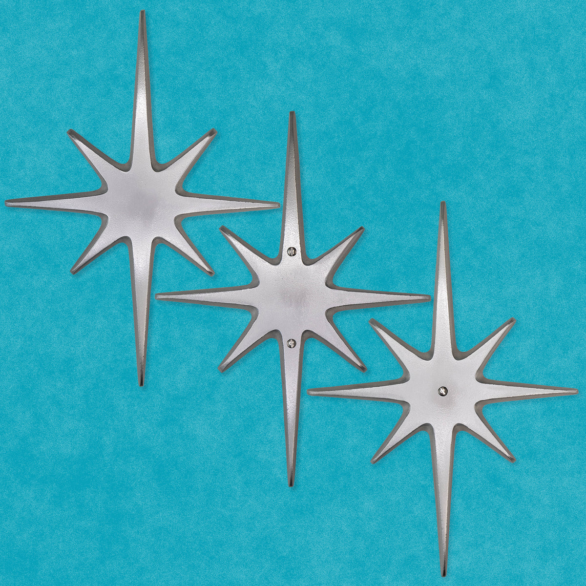 Large 10½-inch handcrafted aluminum Atomic Starburst with shiny hammered finish for door or wall decor.
