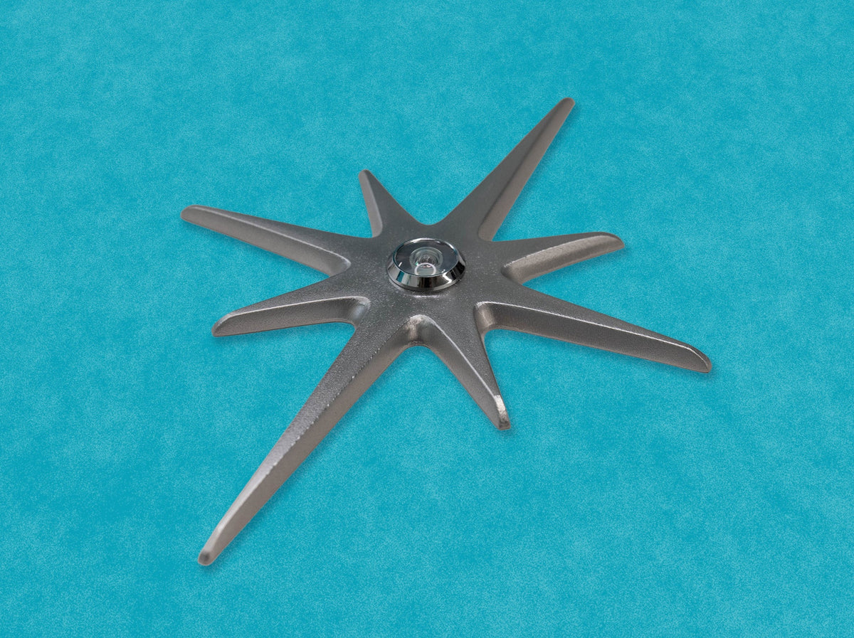 A closer angled look at the natural aluminum starburst. Here the bit of texture is visible in some areas of the starburst. The natural metallic finish is still very smooth and reflects the light. The edges and tips of the starburst are nicely rounded and smoothed. 