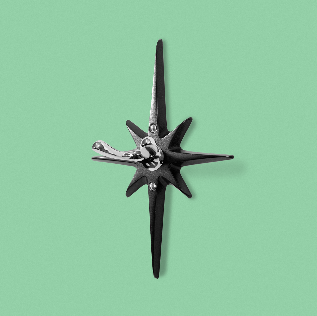 Midnight Star Robe hook featuring matte black cast aluminum starburst and contrasting chrome wall hook