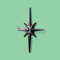 Midnight Star Robe hook featuring matte black cast aluminum starburst and contrasting chrome wall hook