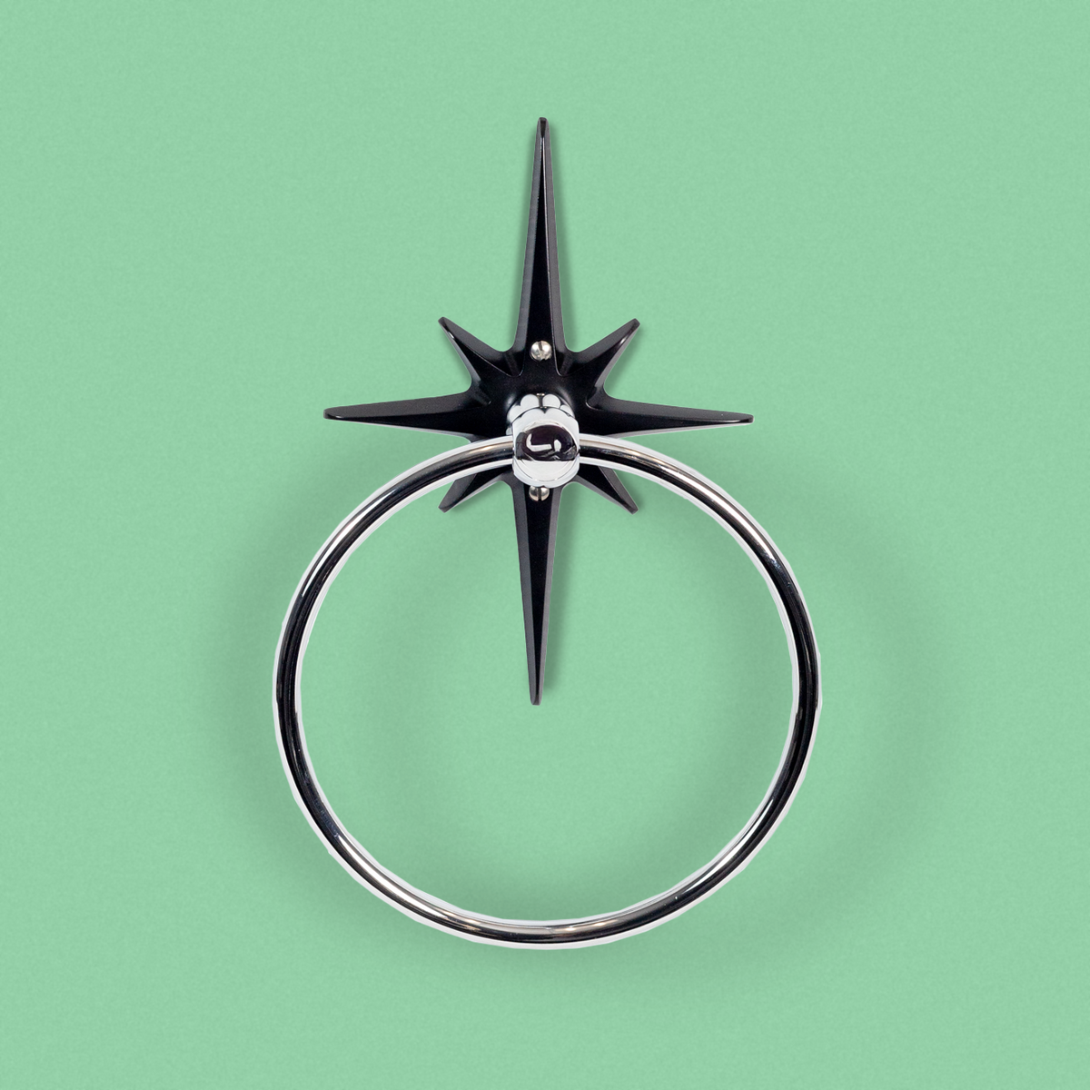 Midnight Star Robe Hook with a polished silver metal hanging ring, and matte black powder-coated cast aluminum starburst shown against a solid mint green background.