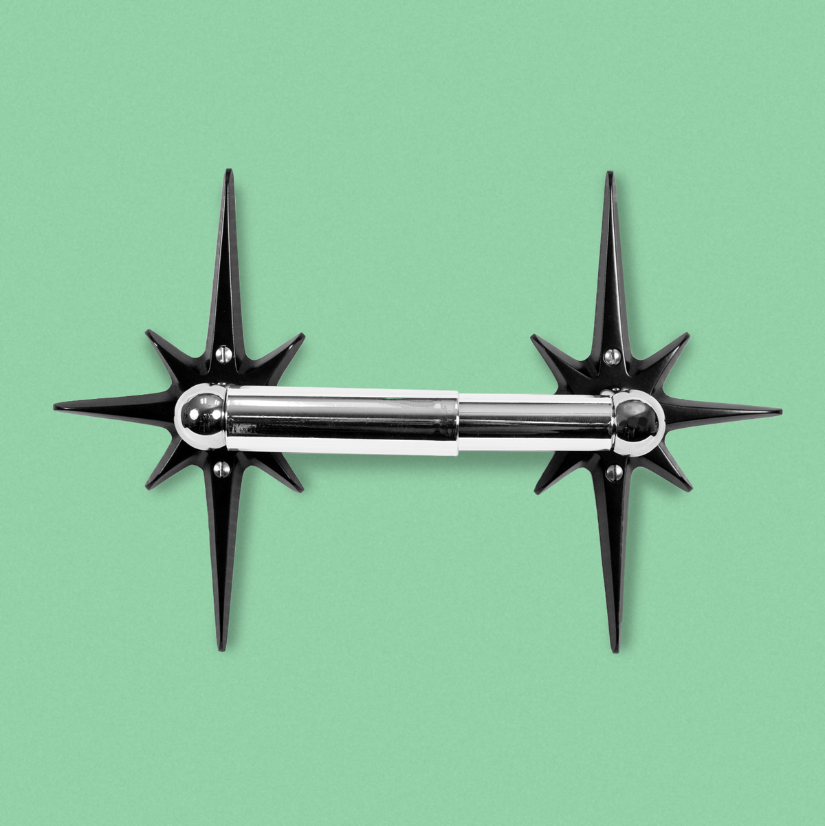 Midnight Star Toilet Paper Holder with two matte black aluminum starbursts and chrome-finished toilet paper rod.