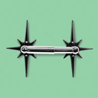 Midnight Star Toilet Paper Holder with two matte black aluminum starbursts and chrome-finished toilet paper rod.