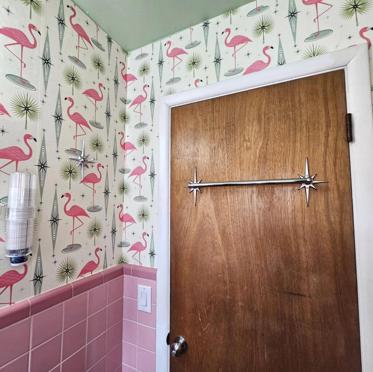 Atomic Starburst bathroom hardware shown installed in a retro-inspired bathroom.