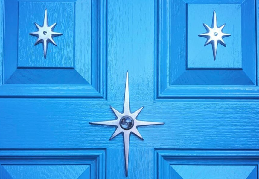 Atomic Starburst Peephole Viewer installed on a vintage-inspired front door.