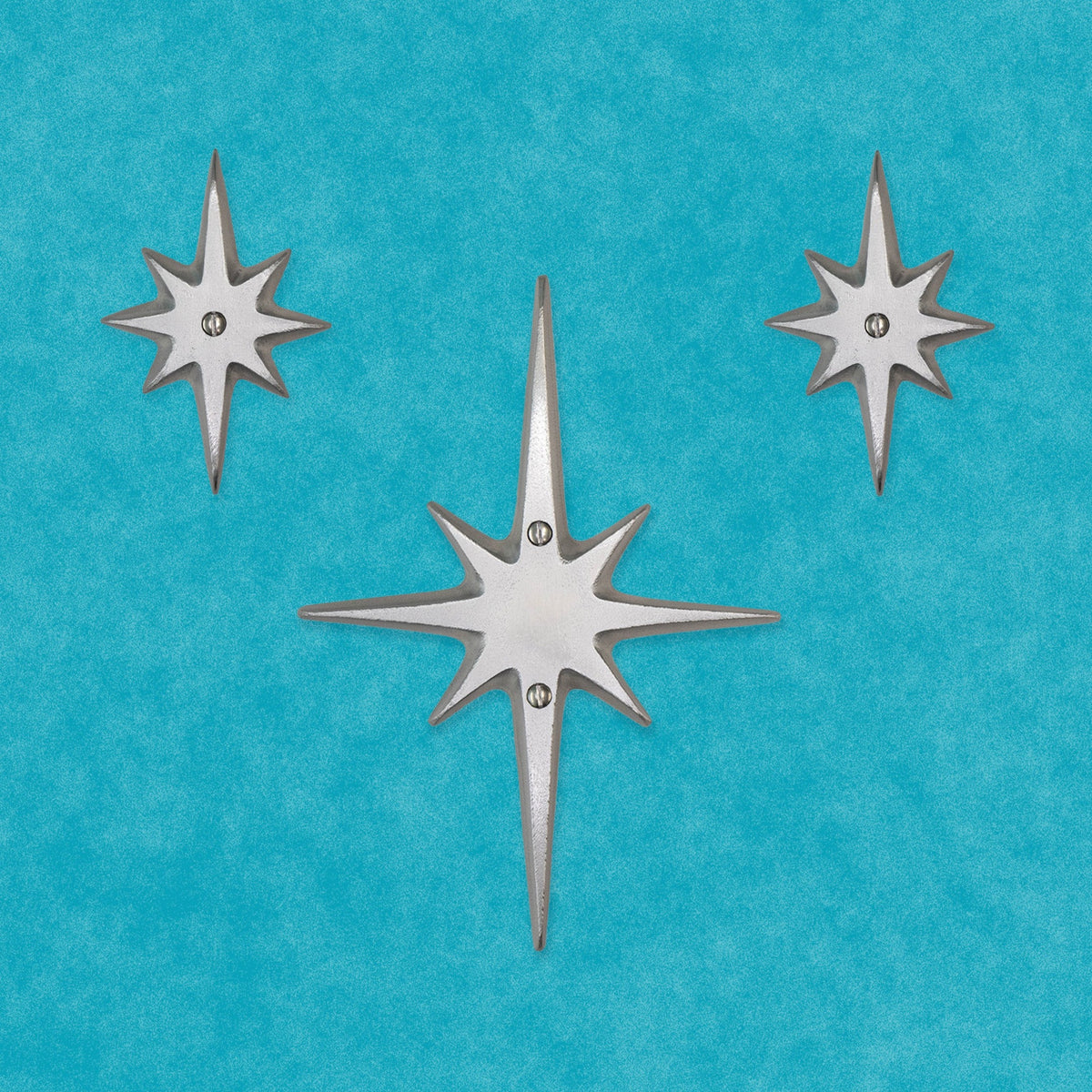 Another arrangement of the set of three without a peephole. The medium starburst is in the center. The two small starbursts are on the upper left and right.