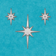 Another arrangement of the set of three without a peephole. The medium starburst is in the center. The two small starbursts are on the upper left and right.