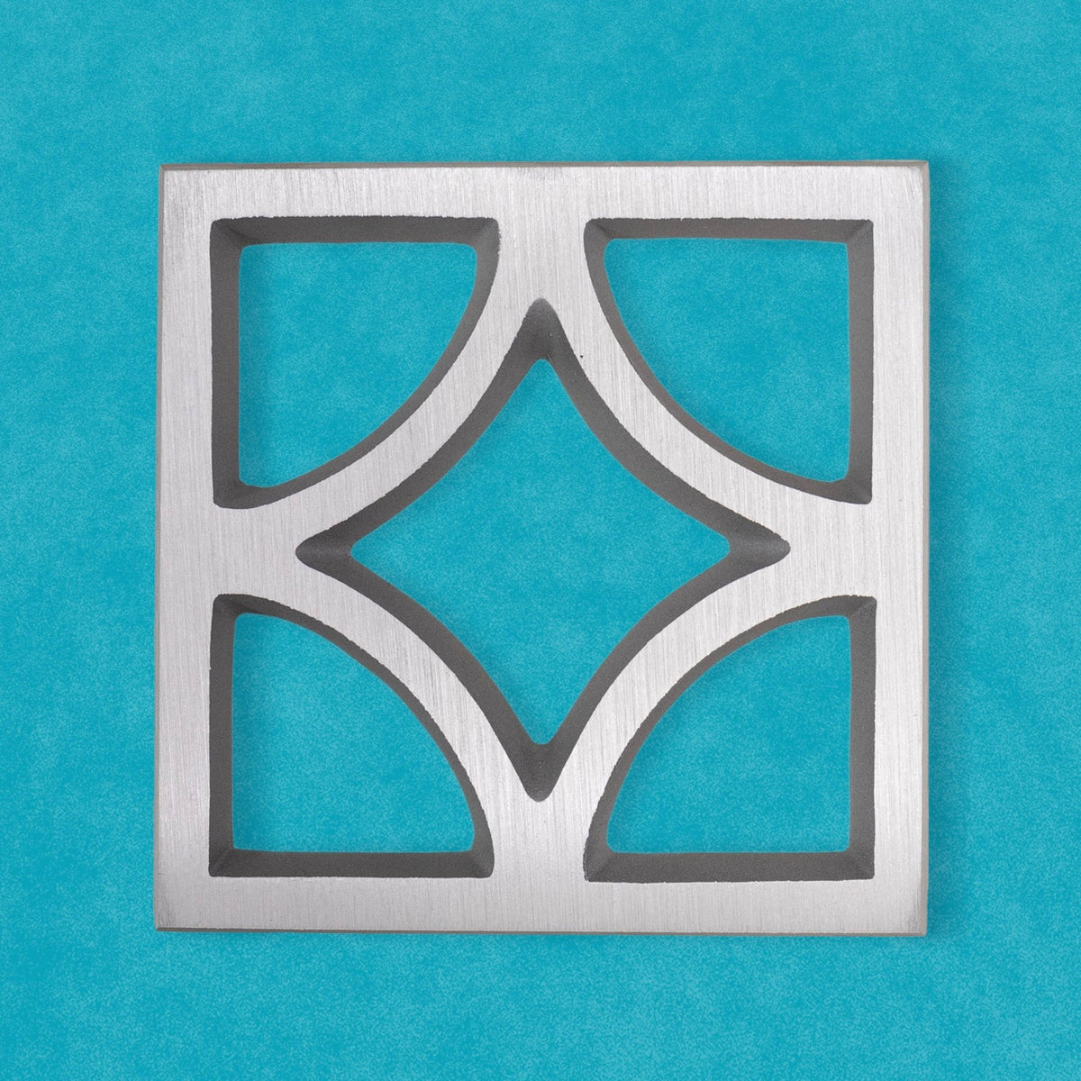 Square Breeze Block decorative plate made from cast aluminum with a geometric mid-century architectural pattern.