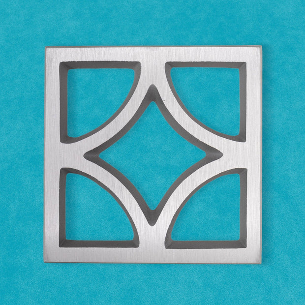 Square Breeze Block decorative plate made from cast aluminum with a geometric mid-century architectural pattern.