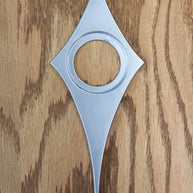 The silver powder coated comet doorknob escutcheon. The surface is very smooth and has a glossy metallic finish. It is a light silver.