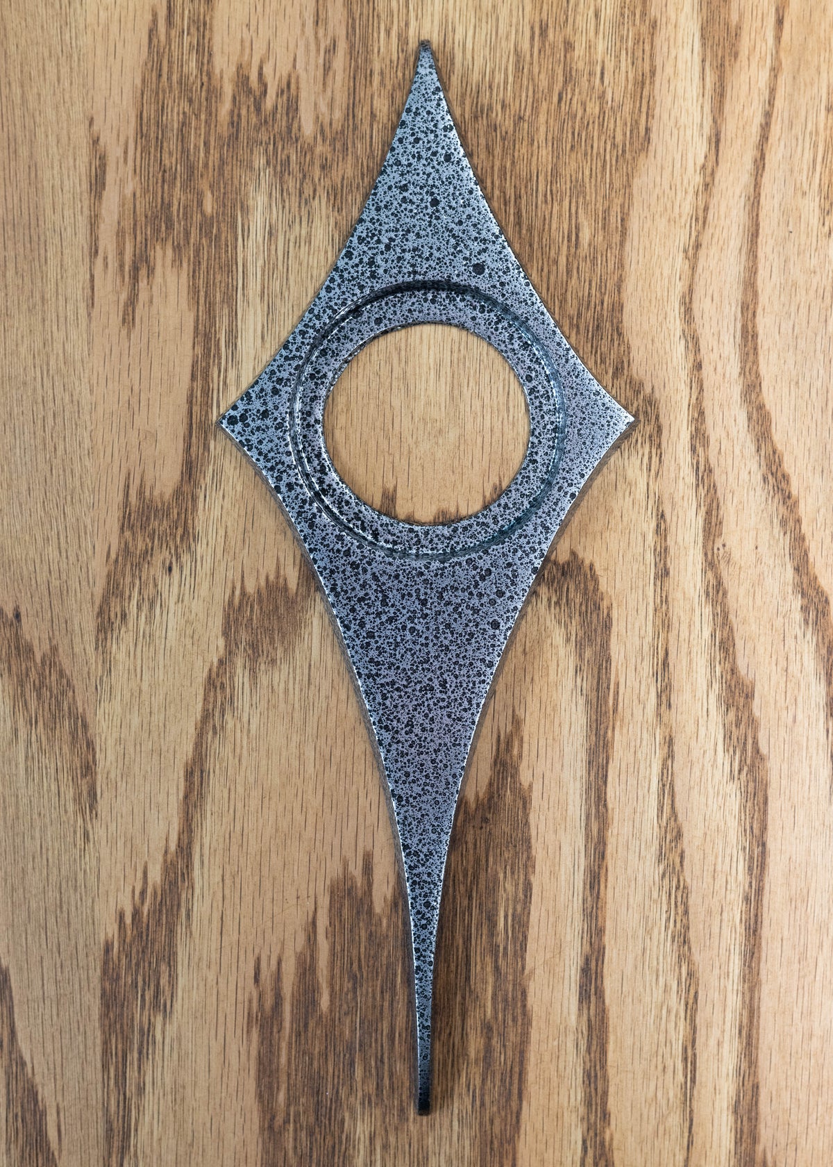 Black frost powder coating is a crackled/ pitted texture that is a mixture of silver and black. still smooth and glossy, has a metallic shine.