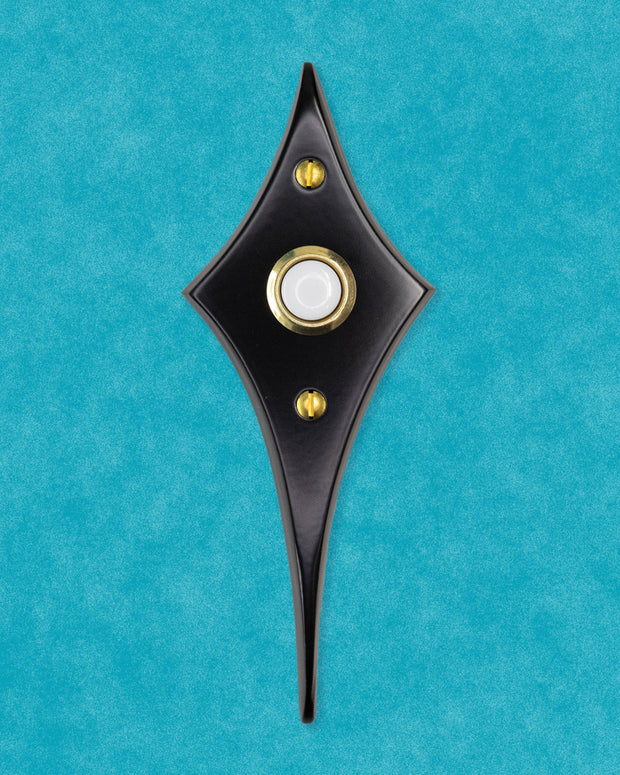 Matte black Comet Doorbell Button with contrasting gold pushbutton.