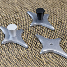 Diamond Star Drawer Pull and polished aluminum backing plate with a matte black cabinet knob.