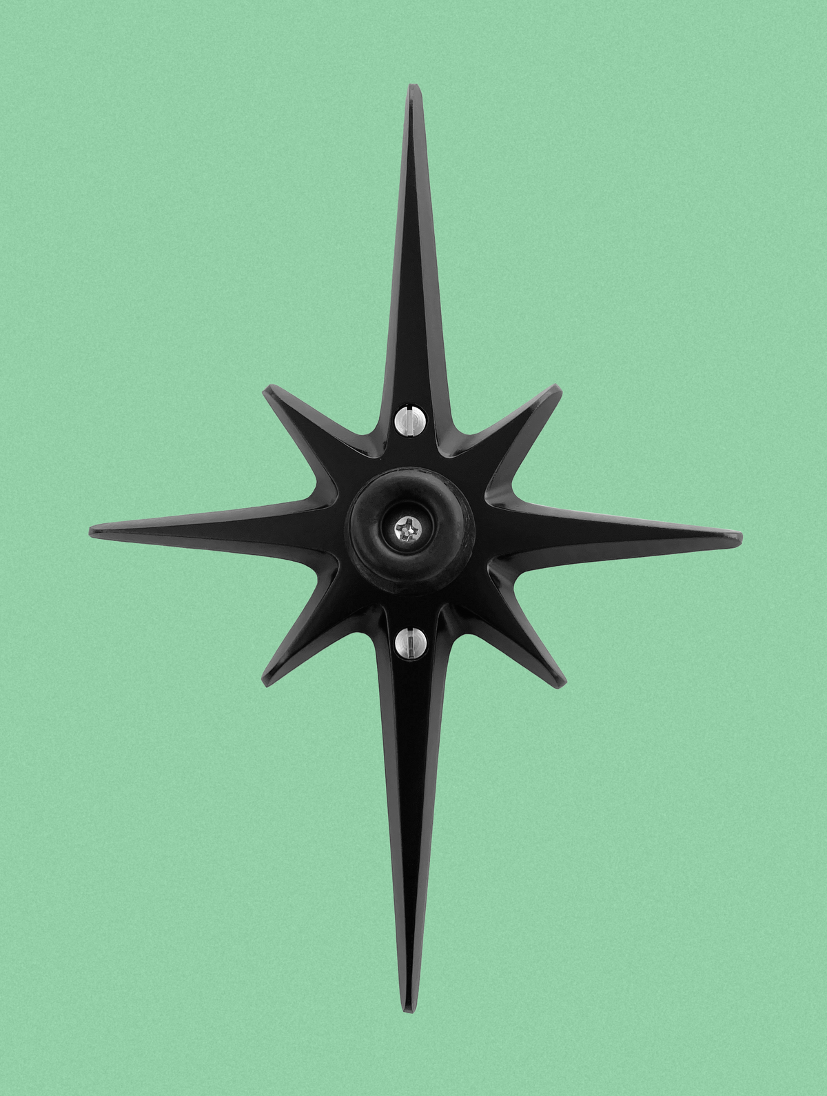 Matte black Atomic Starburst wall-mounted doorstop with soft rubber stopper