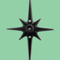 Matte black Atomic Starburst wall-mounted doorstop with soft rubber stopper