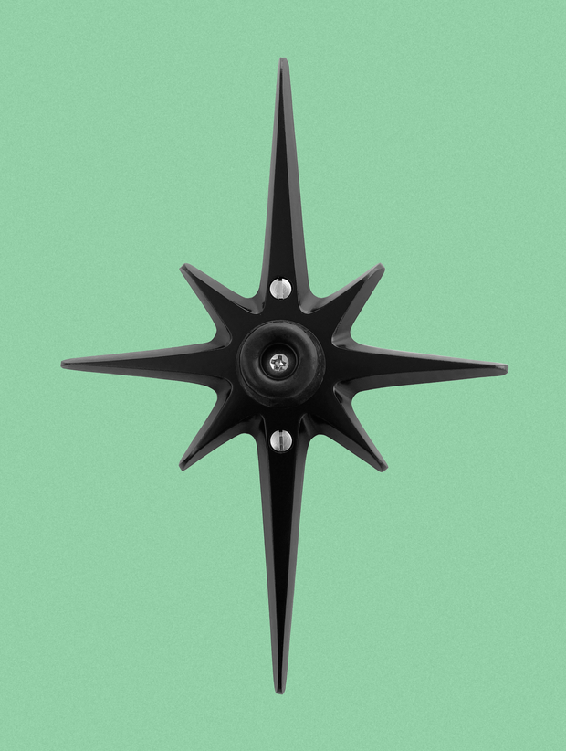 Matte black Atomic Starburst wall-mounted doorstop with soft rubber stopper