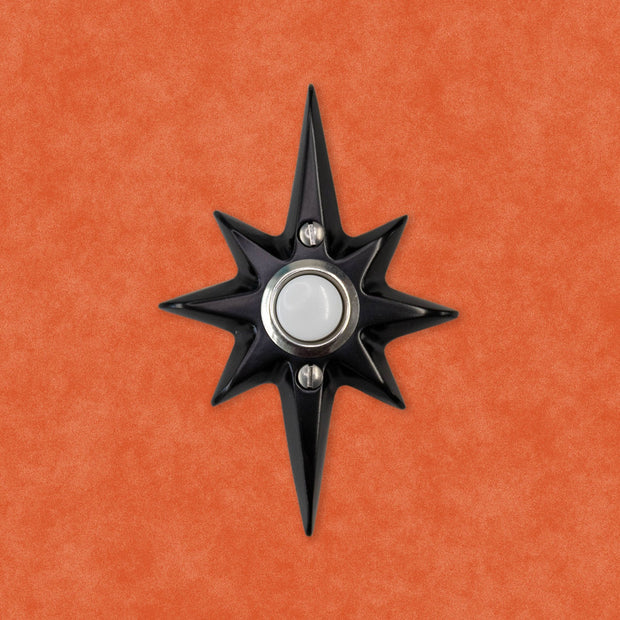 Matte black Atomic Starburst Doorbell Button with contrasting metallic button.