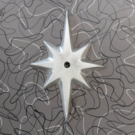 Pre-drilled Atomic Starburst Drawer Pull Backing Plate in shiny hammered cast aluminum without a knob.