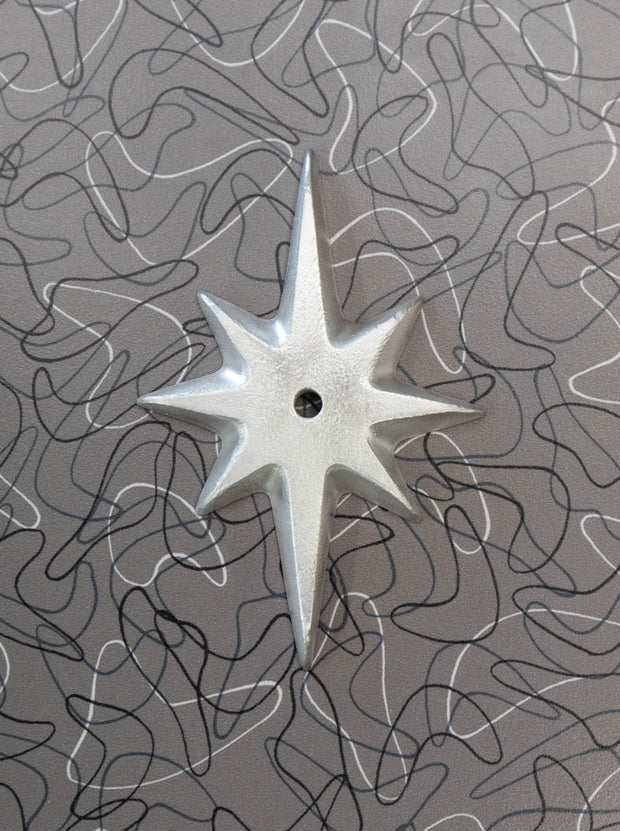 Pre-drilled Atomic Starburst Drawer Pull Backing Plate in shiny hammered cast aluminum without a knob.