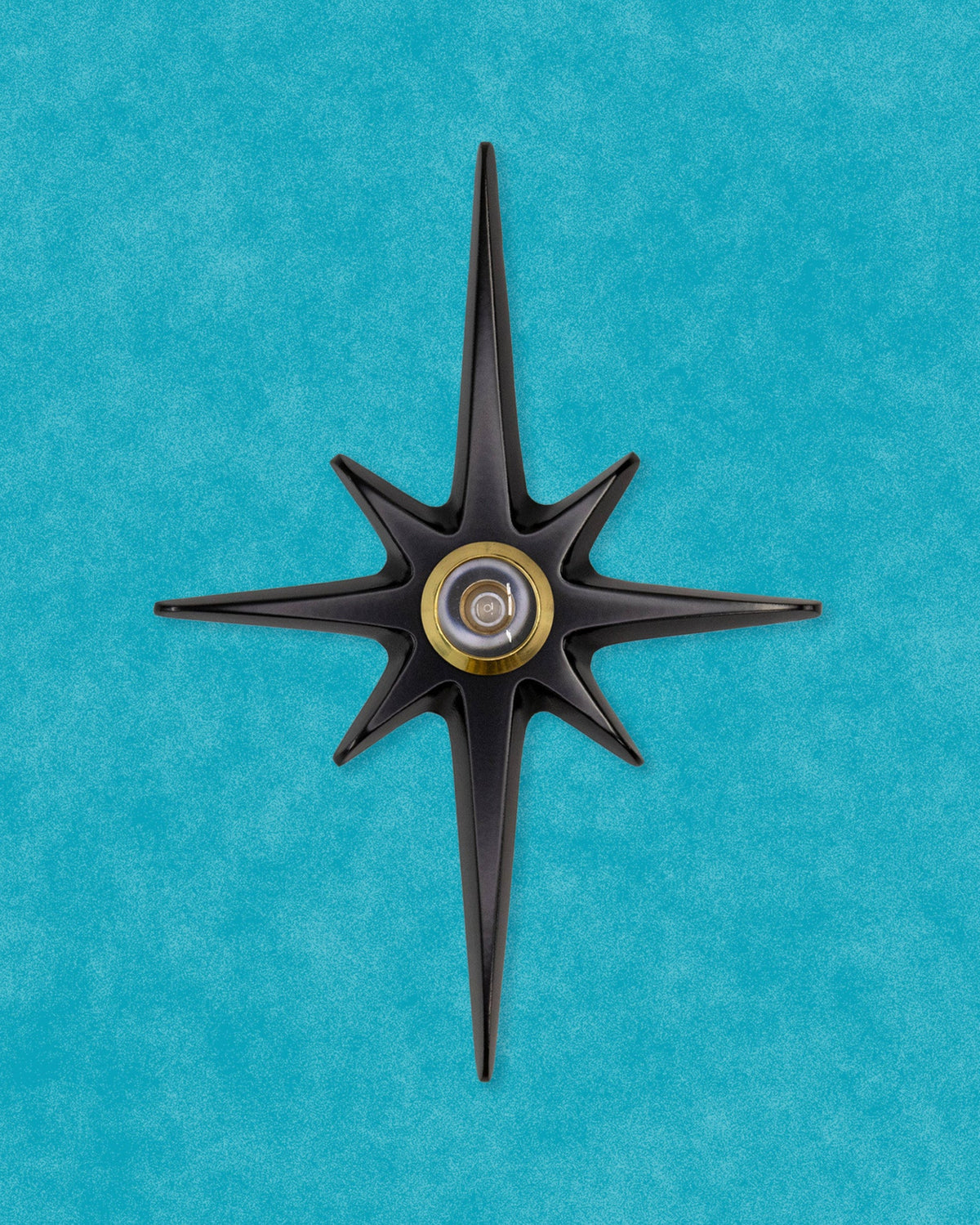 Matte black Atomic Starburst Peephole Viewer with contrasting metallic lens.