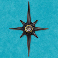 Matte black Atomic Starburst Peephole Viewer with contrasting metallic lens.