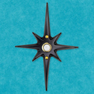 Matte black Atomic Starburst Doorbell Button with contrasting gold pushbutton.