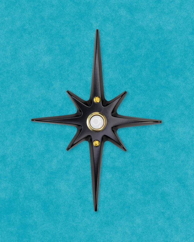 Matte black Atomic Starburst Doorbell Button with contrasting gold pushbutton.