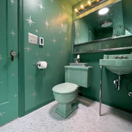 Atomic Starburst bathroom accessories displayed as a coordinated collection.