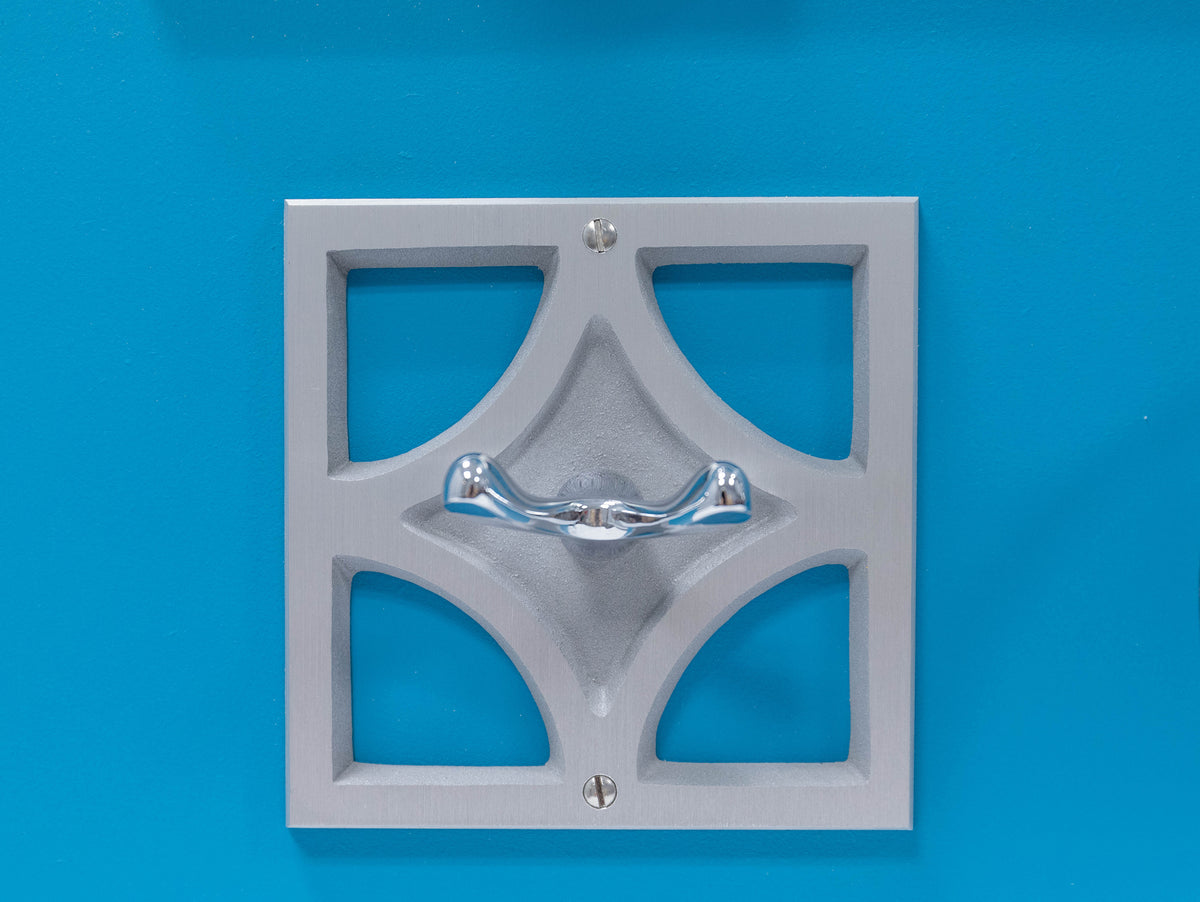 Breeze Block Robe Hook featuring a geometric cast aluminum backplate and polished chrome dual-post hook.