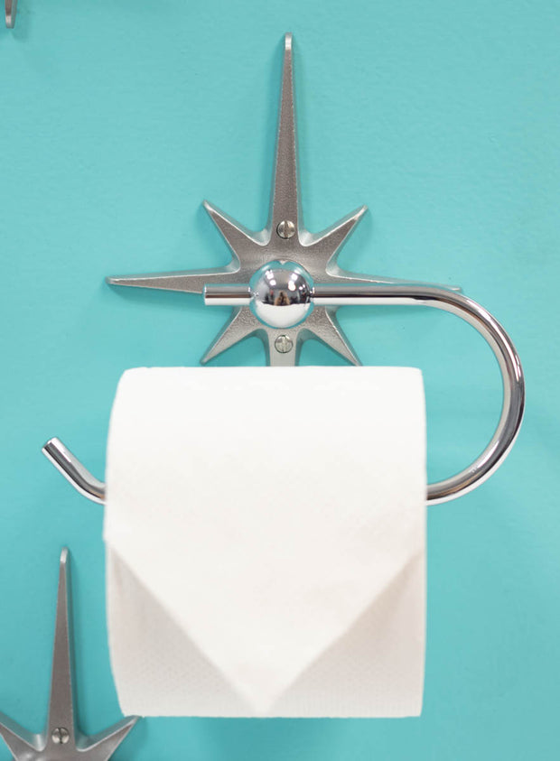 Single-post retro toilet paper holder with chrome-plated stainless steel loop.
